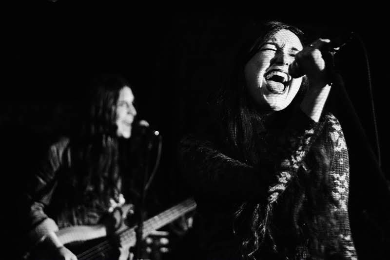 Vocalist mid-performance, black and white